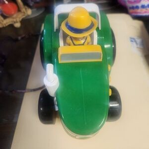 Vibrant Green and Yellow Toy Tractor with Figure